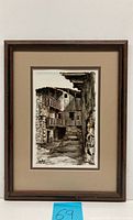 Framed oil painting showing old Spanish building with balconies and approx 13x17 size