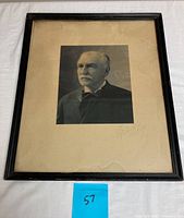 Framed black and white photographic portrait, signed by photographer Chickering B, featuring an elderly man with a mustache, wearing a suit and bow tie.
