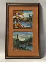 Framed set of two oil on board paintings depicting landscape scenes with water and trees, signed by Benham, against a plain wall.