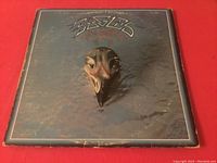 Front cover of Eagles Their Greatest Hits record showing some aged wear and edge scuffing.