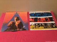 Two vintage The Police LP record covers: 'Zenyatta Mondatta' and 'Synchronicity' showing age wear on covers.