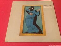 Front cover of Steely Dan Gaucho vinyl record album showing dancing couple artwork and vintage wear on cover.