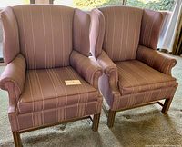 Pair of mid-century wing back chairs with brown silk fabric with white stripes and wood legs