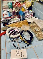 Various hair accessories, combs, headbands, soaps, and sponges arranged on a countertop.