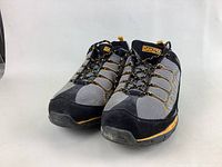 Pair of Dakota men's steel toe work shoes, gray and black with yellow accents, size 10.5, front angle view