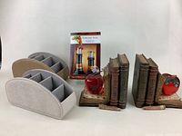Photo showing all items: two fabric organizers with compartments, boxed wine stoppers, and two sets of apple-themed bookends.