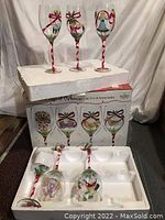 Full set of 12 Days of Christmas glasses displayed with their original box and styrofoam packaging.