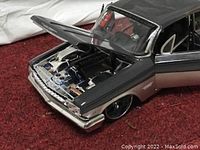 Close-up of the open hood showing detailed engine of the 1962 Chevy Impala SS diecast model car.