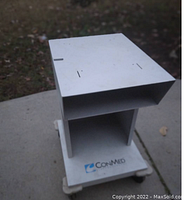 Front angle showing ConMed logo, top surface and storage shelf.