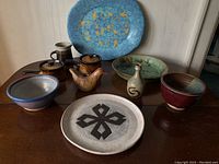 Overview of all pottery items showing the variety of shapes, glazes and colors in the collection.