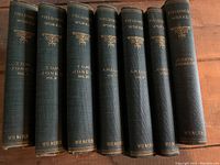 7 volumes of Henry Fielding's works showing titles and decorative spines