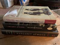 Stack of three Margaret Atwood books showing spines and some cover detail.
