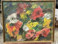 Full view of the framed floral oil painting showing colorful flowers in reds, yellows, whites, and greens with a gold frame.