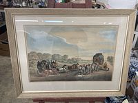 Full view of the framed artwork showing the scene of horses and carriages on a countryside road.
