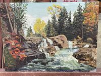 Full view of the 16 x 12 inch oil painting depicting a waterfall cascading over rocks with surrounding evergreen and deciduous trees in autumn colors.