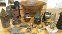 Overview showing all items in the lot including vegetable bin, candle holders, oil lamp, and baking tins.