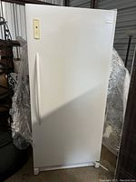 Front view of closed freezer showing exterior finish and integrated handle