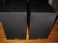 Front view of both JBL Loft 40 speakers showing black fabric grills with JBL logo