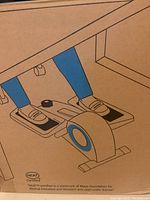 Box side showing illustration of the Cubii elliptical under desk with foot pedals and resistance knob.