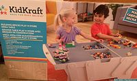 Front of retail box showing KidKraft branding and children playing at table