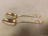 Pair of two 800 solid silver German teaspoons placed side by side, showing overall shape and condition