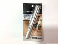 Front view of CoverGirl Exhibitionist Mascara in sealed packaging showing silver tube, branding and product claims.