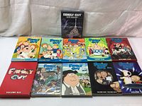 Front view of Family Guy DVD volumes 1 to 10 and Blue Harvest DVD in original cases.