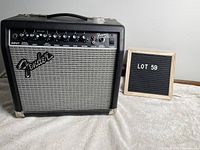 Front view of Fender Frontman 15R amp showing control panel with knobs and inputs along with Fender logo and Lot 59 sign.