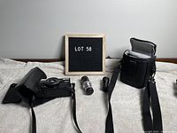 Full lot with Minolta camera in leather case, two iPhone 6 lenses, and Roots camera bag.