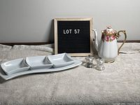 Full view of the lot showing Royal Albert teapot, salt and pepper shakers, and white tapas serving dish