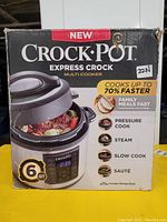 Boxed Crock-Pot Express Crock Multi-Cooker showing product image and features printed on front of box.