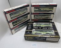 Overall shot of two K-Line boxes and six Lionel boxes