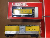 Yellow/silver Lionel boxcar in original red and white packaging