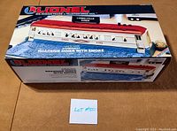 Box front view showing the Lionel Lionelville Diner model, scale 27 gauge, illuminated with smoke, unopened box but used condition visible.