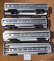 Overhead view of all four Williams Canadian Pacific passenger cars in original boxes showing labels and details