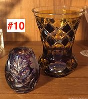 View of both Bohemian cased glass vases together, showing size difference and cut patterns.