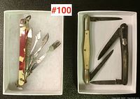 Top-down view of all three pocket tools in white boxes showing marbled, natural, and dark handles with folded and unfolded metal implements.