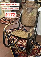 Front three-quarter view of bentwood rocking chair on patterned rug