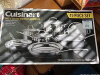 Photo of the box showing the brand, product line, and the full 11-piece stainless steel cookware set.
