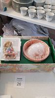 Full view of the Cherished Teddies Tristan 2002 figurine inside its decorative box with protective styrofoam and plastic wrap.