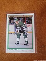 Front of Bobby Holik rookie card showing player in green Hartford Whalers uniform with O-Pee-Chee Premier logo.