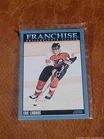 Front side of the Eric Lindros Franchise hockey card from Score, showing Lindros skating in Flyers uniform.