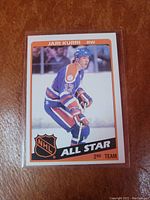 Front of 1983-84 Jari Kurri NHL All Star hockey card showing player image, jersey number 17 in Edmonton Oilers uniform, NHL All Star 2nd Team indication.