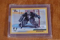 Front view of the Jean-Sebastien Giguere hockey card number 46/50 inside plastic casing.
