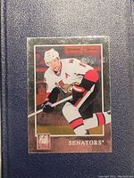 Holographic Jason Spezza hockey card showing him in Ottawa Senators uniform.