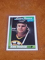 Front view of the Ken Hodge Super Rookie hockey card showing player image and card design.