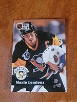 Front of Mario Lemieux hockey card showing player in Pittsburgh Penguins uniform with captain patch and NHL Pro Set logo.