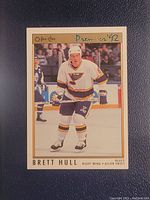 Front of Brett Hull Premier '92 hockey card showing player in St. Louis Blues uniform on ice rink.