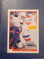 Front of Ron Hextall hockey card showing player in New York Islanders gear.