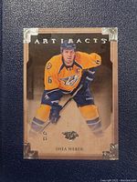 Front view of Shea Weber hockey card in Nashville Predators uniform, labeled Artifacts, showing player image and card logo.